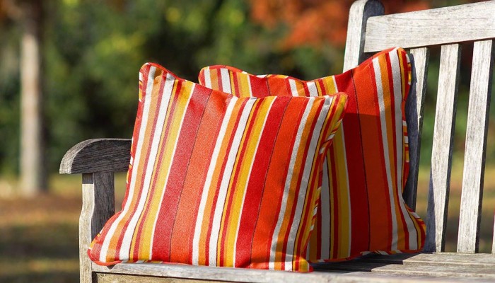 Custom throw pillows featuring PARA` Tempotest MB Sea Stripe Mango fabric